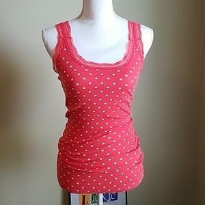 Coral tank with white polka dots and lace trim